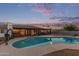 Inviting backyard pool surrounded by mature palm trees and a serene atmosphere at 2037 E Riviera Dr, Tempe, AZ 85282