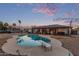 Beautiful backyard pool with a diving board, perfect for relaxation and recreation at 2037 E Riviera Dr, Tempe, AZ 85282