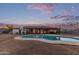 Backyard featuring a sparkling pool, covered patio, and well-maintained yard at 2037 E Riviera Dr, Tempe, AZ 85282