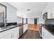 Bright kitchen featuring stainless steel appliances and dark countertops at 2235 N 12Th St, Phoenix, AZ 85006