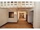 Long hallway with exposed beams and hardwood floors at 2244 E Colter St, Phoenix, AZ 85016