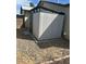 Backyard shed with a door and small windows at the top surrounded by gravel at 2331 W Onza Ave, Mesa, AZ 85202