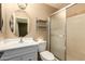 Clean bathroom with shower/tub combo, vanity, and shelving at 2331 W Onza Ave, Mesa, AZ 85202