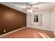 Spacious bedroom with wood flooring and ceiling fan at 2331 W Onza Ave, Mesa, AZ 85202
