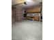 A spacious garage with built-in storage, painted floor, and an automatic door opener at 2331 W Onza Ave, Mesa, AZ 85202