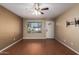 Living room with laminate wood floors and ceiling fan at 2331 W Onza Ave, Mesa, AZ 85202