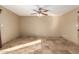 Bright living room with tile floors and ceiling fan at 2331 W Onza Ave, Mesa, AZ 85202