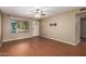 Living room featuring laminate floors and a ceiling fan at 2331 W Onza Ave, Mesa, AZ 85202