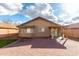 Brick patio and grassy backyard with a covered patio at 25700 W St James Ave, Buckeye, AZ 85326