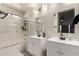 Clean bathroom with double sinks, tub, and updated fixtures at 25700 W St James Ave, Buckeye, AZ 85326