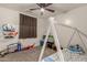bedroom with toy storage and window coverings at 25700 W St James Ave, Buckeye, AZ 85326