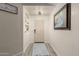 Bright entryway with light gray floors and a large framed picture at 25700 W St James Ave, Buckeye, AZ 85326