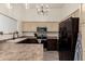 Updated kitchen featuring stainless steel appliances and stylish dark wood cabinets at 25700 W St James Ave, Buckeye, AZ 85326