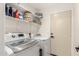 Laundry room with washer, dryer, and shelving at 25700 W St James Ave, Buckeye, AZ 85326