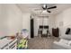 Versatile room with workspace, crib, and comfortable seating at 25700 W St James Ave, Buckeye, AZ 85326