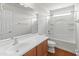 Clean bathroom, bathtub, and wood-look flooring at 26234 W Behrend Dr, Buckeye, AZ 85396