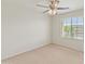 Light and airy bedroom with ceiling fan and window with view at 26234 W Behrend Dr, Buckeye, AZ 85396