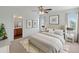 Bright bedroom featuring a comfy bed and ensuite bathroom at 26234 W Behrend Dr, Buckeye, AZ 85396