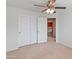 Bedroom with double doors leading to upper loft at 26234 W Behrend Dr, Buckeye, AZ 85396