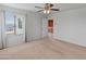 Well-lit bedroom with ceiling fan and access to upper loft at 26234 W Behrend Dr, Buckeye, AZ 85396