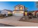 Two-story house with a large garage and landscaped front yard at 26234 W Behrend Dr, Buckeye, AZ 85396