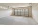 Spacious garage with an overhead door at 26234 W Behrend Dr, Buckeye, AZ 85396