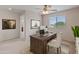 Home office with a large desk, chair, and access to bathroom at 26234 W Behrend Dr, Buckeye, AZ 85396