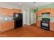 Modern kitchen with ample cabinet space and wood flooring at 26234 W Behrend Dr, Buckeye, AZ 85396