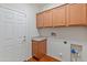 Laundry room with upper cabinets and a countertop at 26234 W Behrend Dr, Buckeye, AZ 85396