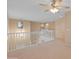 Bright loft with a view to the staircase and a carpeted floor plan at 26234 W Behrend Dr, Buckeye, AZ 85396