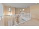 Bright loft with a view to the staircase and a carpeted floor plan at 26234 W Behrend Dr, Buckeye, AZ 85396