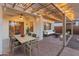 Relaxing patio with pergola, dining area, and seating at 26234 W Behrend Dr, Buckeye, AZ 85396