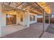 Patio with pergola, string lights, and access to backyard at 26234 W Behrend Dr, Buckeye, AZ 85396