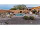 Private backyard oasis with a pool and seating area at 26234 W Behrend Dr, Buckeye, AZ 85396