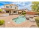 Backyard with pool, patio, and outdoor kitchen at 26234 W Behrend Dr, Buckeye, AZ 85396