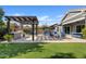 Landscaped backyard with pergola, grill and artificial turf at 2683 E Indigo Pl, Chandler, AZ 85286