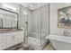 Modern bathroom with a large walk-in shower and soaking tub at 2683 E Indigo Pl, Chandler, AZ 85286