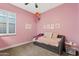 Charming bedroom with daybed, pink walls, and decorative wall art at 2683 E Indigo Pl, Chandler, AZ 85286