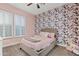 bedroom with floral wallpaper and comfy bed at 2683 E Indigo Pl, Chandler, AZ 85286