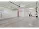 Garage with overhead storage racks and epoxy flooring at 2683 E Indigo Pl, Chandler, AZ 85286