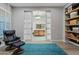 Relaxing Gathering room with leather recliner and sliding barn doors at 2683 E Indigo Pl, Chandler, AZ 85286