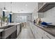 Modern kitchen with farmhouse sink, white cabinets, and stainless steel appliances at 2683 E Indigo Pl, Chandler, AZ 85286