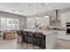 Modern kitchen with large island, white cabinets, and stainless steel appliances at 2683 E Indigo Pl, Chandler, AZ 85286