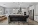 Modern kitchen with large island, white cabinets, and stainless steel appliances at 2683 E Indigo Pl, Chandler, AZ 85286