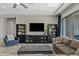 Living room with modern built-ins, comfortable seating, and stylish rug at 2683 E Indigo Pl, Chandler, AZ 85286