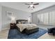 Main bedroom with king-size bed and ample natural light at 2683 E Indigo Pl, Chandler, AZ 85286