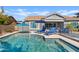 Relaxing backyard oasis with a sparkling pool and lounge chairs at 2683 E Indigo Pl, Chandler, AZ 85286