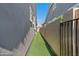 Artificial turf side yard with block wall fencing at 2683 E Indigo Pl, Chandler, AZ 85286