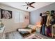Bedroom with gray walls, wood floor, simple bed, and closet clothes rack at 2901 E Iris Dr, Chandler, AZ 85286