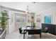 Bright dining room with a bay window and a modern black table set for stylish meals at 2901 E Iris Dr, Chandler, AZ 85286